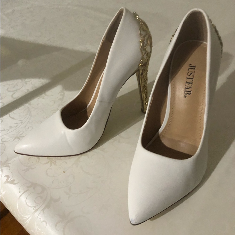 White pumps with gold detailing